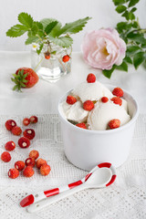 Vanilla ice cream with fresh wild strawberries