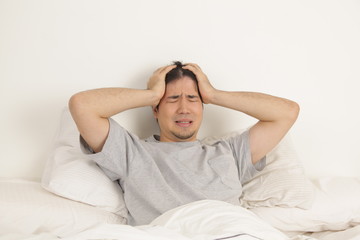 Man lying with headache