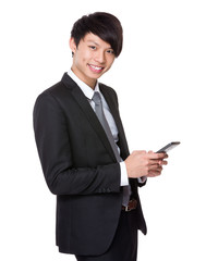 Fototapeta na wymiar Young businessman use of the cellphone