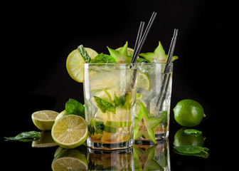 Mojito drinks on black background