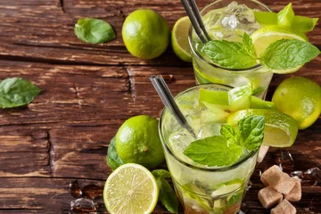 Tuinposter Mojito drinks on wooden planks © Jag_cz