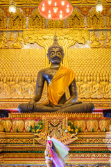 tin buddha sculpture