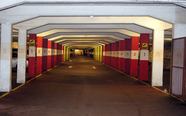 Fototapeta premium Basement car parking with the numbers on the pillars