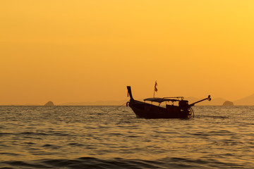 The ship floats in the sea in the evening.