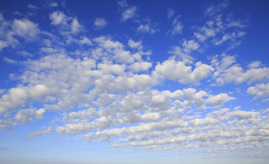 Beautiful cumulus cirrus clouds in blue sky. - obrazy, fototapety, plakaty