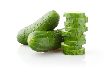 Fresh Cucumbers and Slices on white