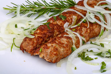 Kebab with onion rings