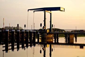 Fototapeten zonsondergang brug Oude IJssel  © henkbouwers