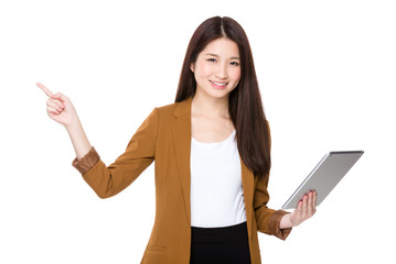 Asian young businesswoman use of tablet pc and finger point up