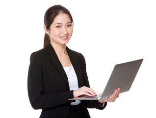 Young businesswoman use of the notebook computer
