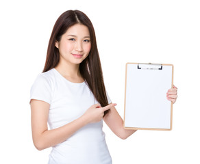 Asian young woman finger point to blank page of clipboard