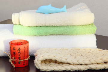 Towel stack and bast in shower.
