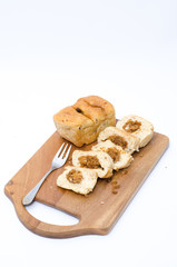dried shredded pork bread on cutting board on a white background