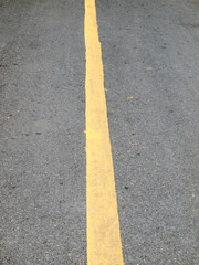 Close up road divide yellow line