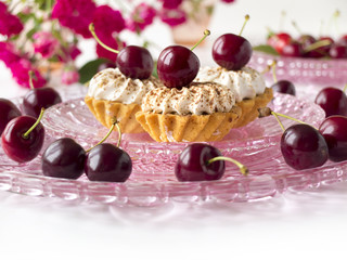 Cupcake with cherries and whipped cream