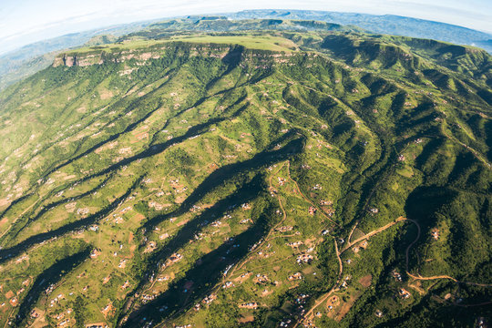 Aerial flying Inanda Valley hills valleys tribal homes landscape outside Durban
