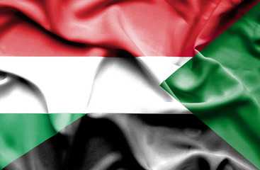 Obraz premium Waving flag of Sudan and Hungary