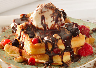 Ice cream chocolate sauce with fruit Belgian waffel