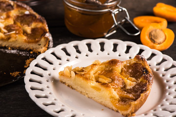 Homemade apricot tart with almonds and fresh fruits