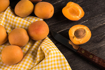 Fresh ripe apricot fruits on wooden rustic table