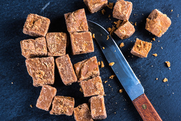 Traditional homemade fudge toffee, cut in squares cubes