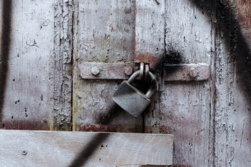 fragment of an old wooden door with old locks