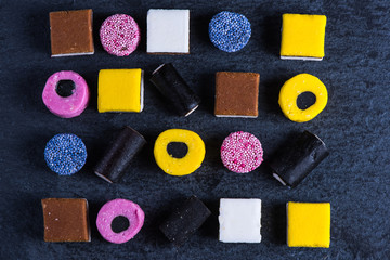 Liquorice candy vibrant background, from above