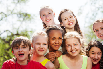Close-up view of teenagers diversity sitting close