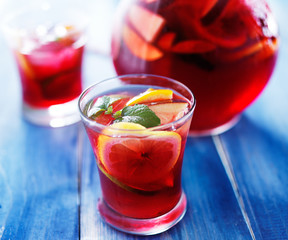 sangria with fruits and mint garnish in cup