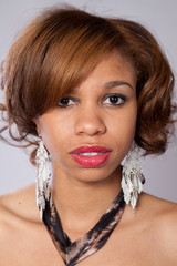 Pretty black woman looking thoughtful