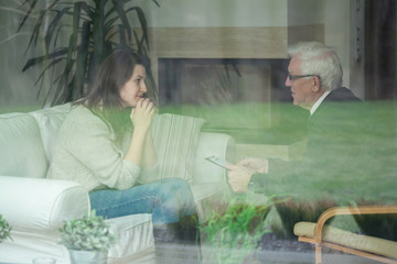 Retired psychologist consulting his patient - obrazy, fototapety, plakaty