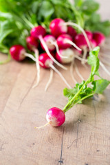 fresh radish on wooden surface