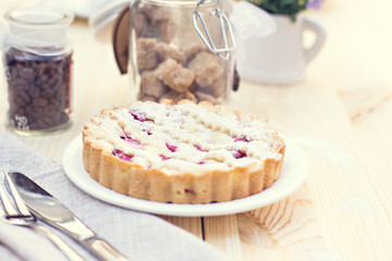 Homemade pie with coffee on a wooden background