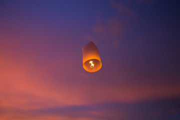 Floating lanterns in the evening sky