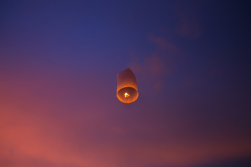 Floating lanterns in the evening sky