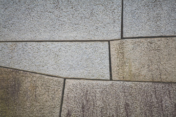 Old stone block wall background and texture
