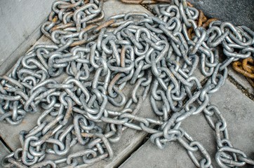 Old chain on a cement floor/ Old chains form top view 