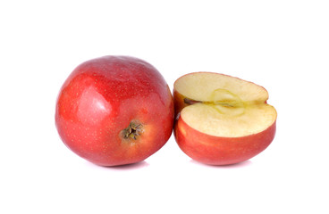 whole and half cut red apples with stem on white background