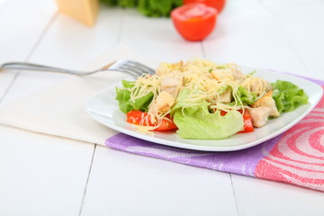 Caesar salad in a white plate
