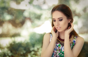 Fototapeta premium Stylish Woman Wearing Floral Dress and Big Necklace