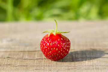 ripe fresh strawberries on wooden background, close up