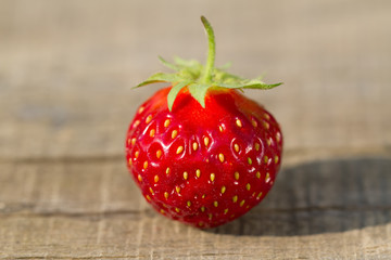 ripe fresh strawberries on wooden background, close up
