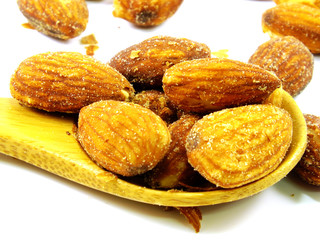 salted and roasted almond isolated on white background