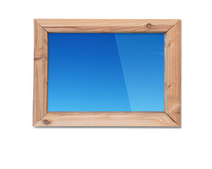Wooden frame window with view of blue sky