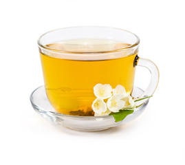 isolated transparent cup of tea with jasmine flowers. 