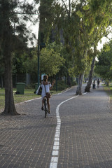 Girl riding a bicycle in a park