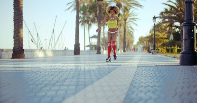 Sexy Roller Girl Skating on Exotic Promenade