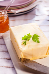 Pat of fresh farm butter on a picnic blanket