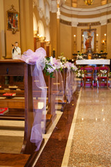 Fototapeta na wymiar Bows in Catholic Church before a wedding