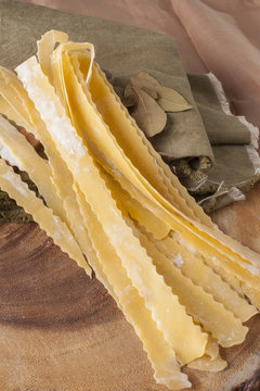 Mafaldine Pasta, curl texture of Home made mafaldine pasta flour ribbon noodle